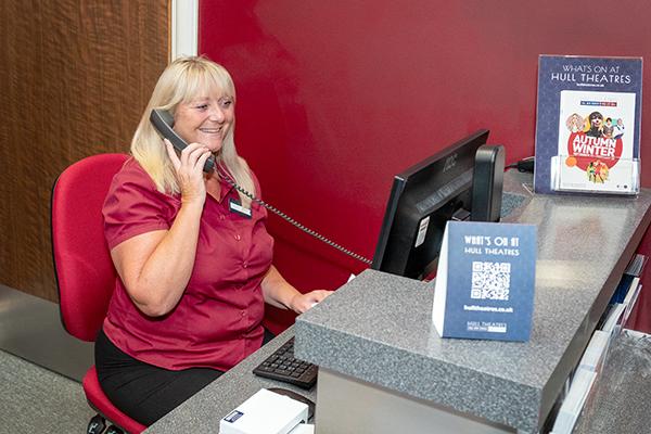 Image of a person answering the telephone