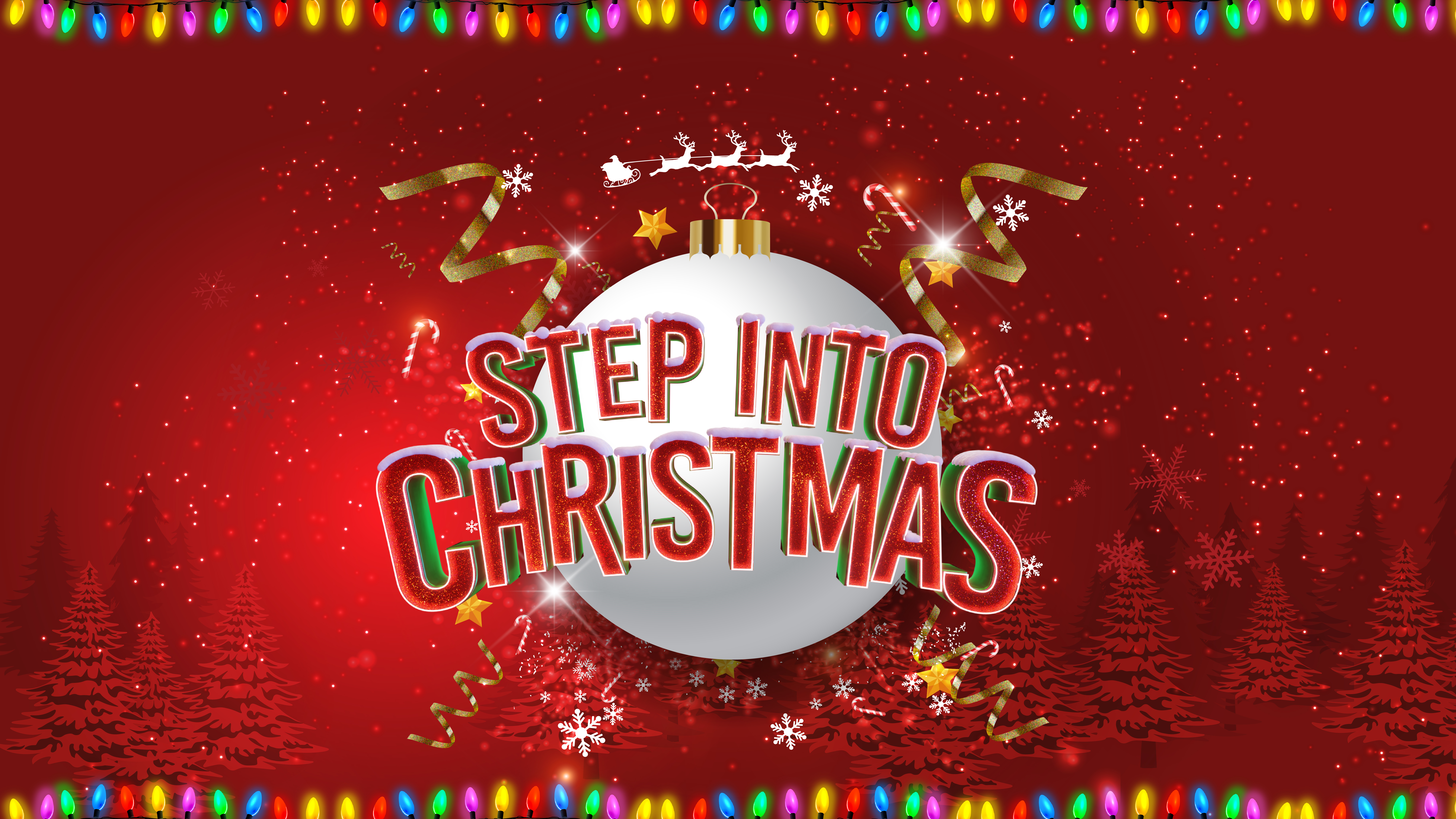 White Christmas Tree bauble with Step Into Christmas written in front of it and other festive decorartions 