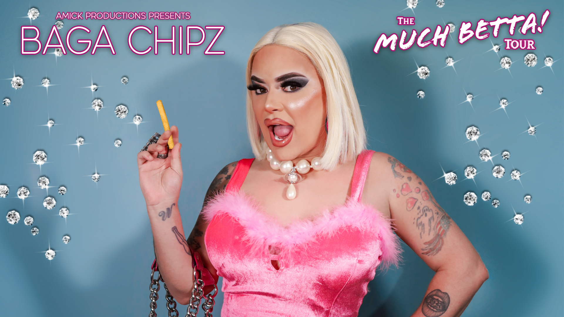 A drag queen in a pink dress and blonde wig poses with a bag full of chips